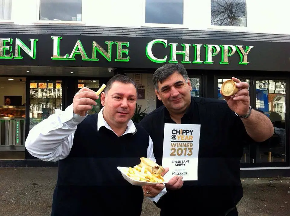 Paul and Andy, owners of Green Lane Chippy, standing in front of the shop